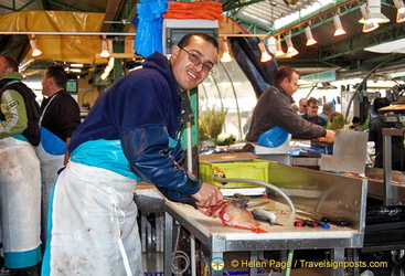 A friendly fishmonger at work